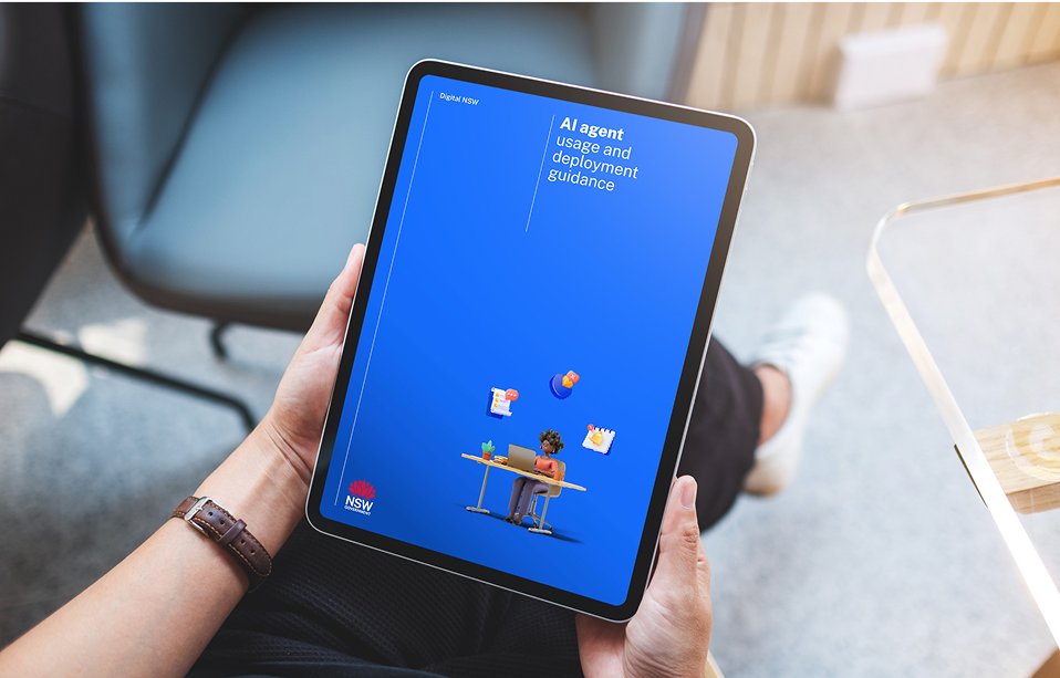 Photo of a tablet showing 'AI agent usage and deployment guidance' with NSW logo and desk illustration
