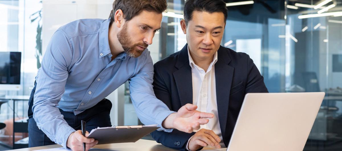 two businessmen with laptop