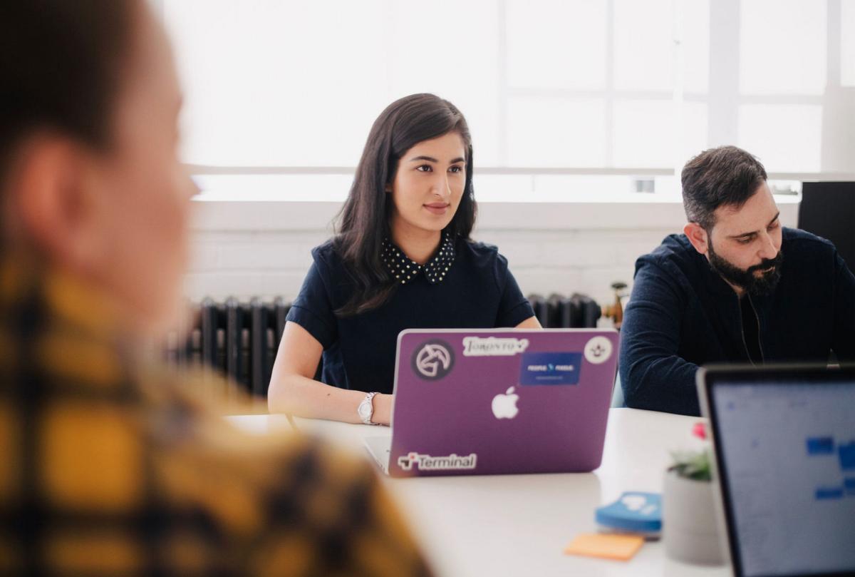 Woman on purple laptop